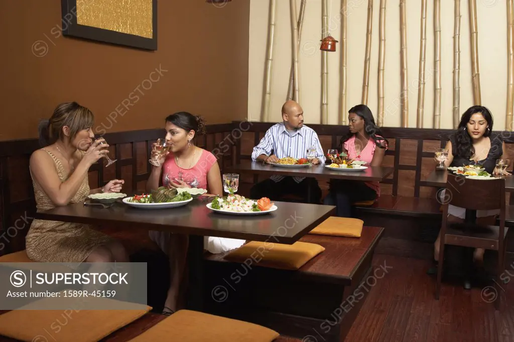 Multi-ethnic diners in restaurant