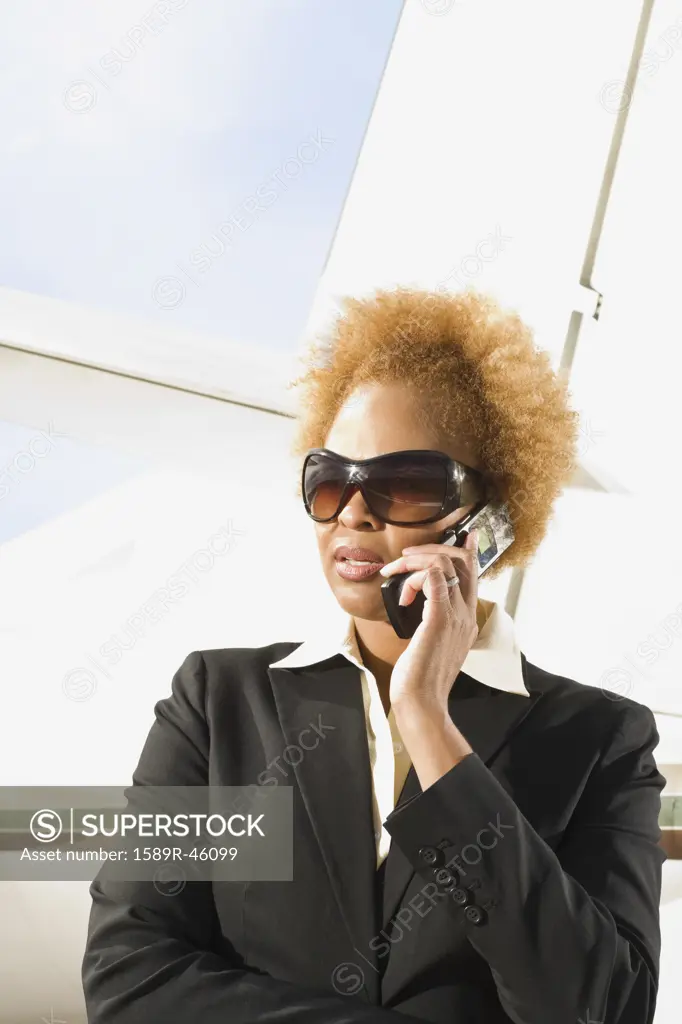 African American businesswoman talking on cell phone