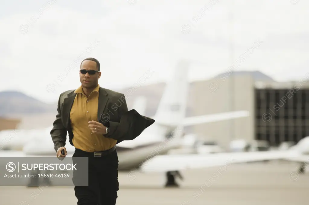 African man running from airplane