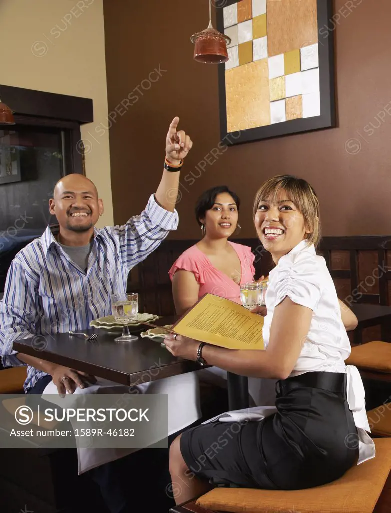 Multi-ethnic friends at restaurant