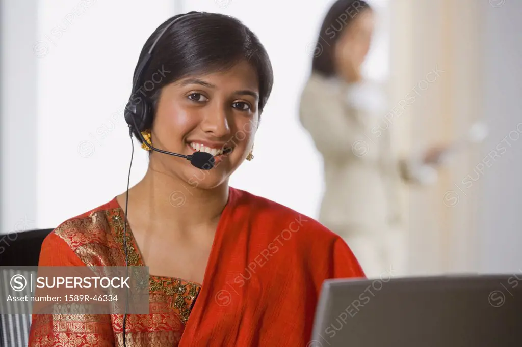 Indian businesswoman wearing headset