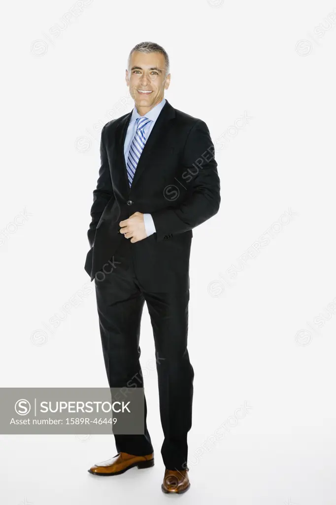 Middle Eastern businessman with hand on jacket button