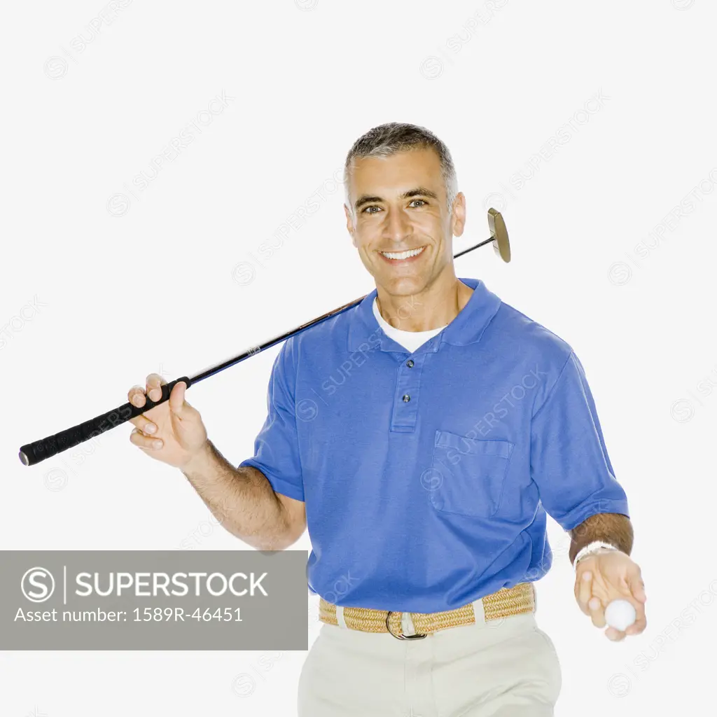 Middle Eastern man holding golf club