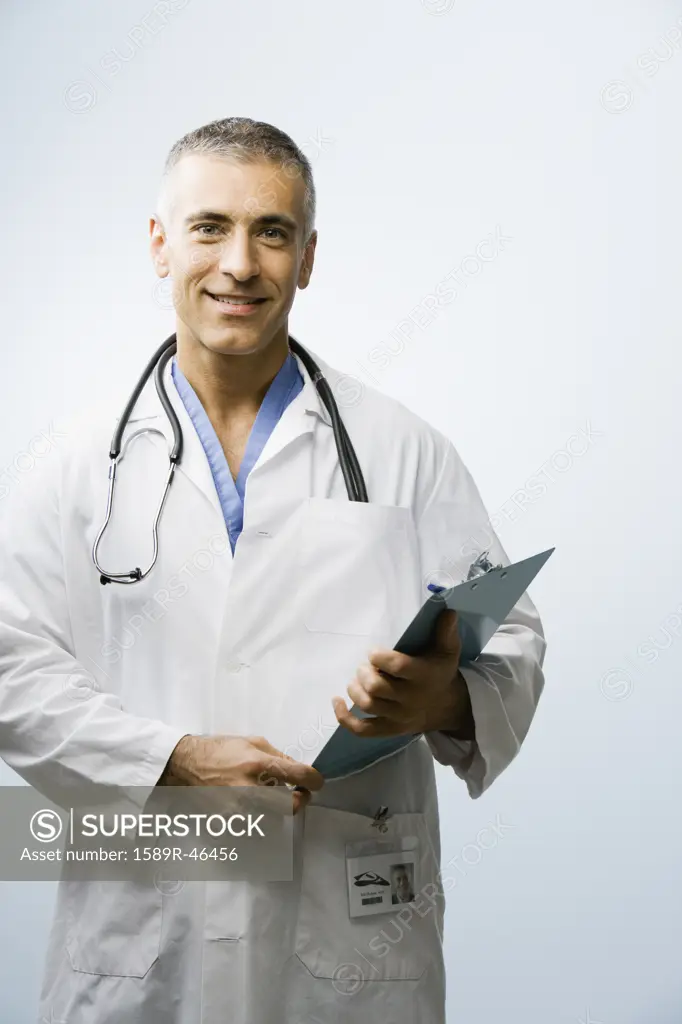 Middle Eastern male doctor holding chart