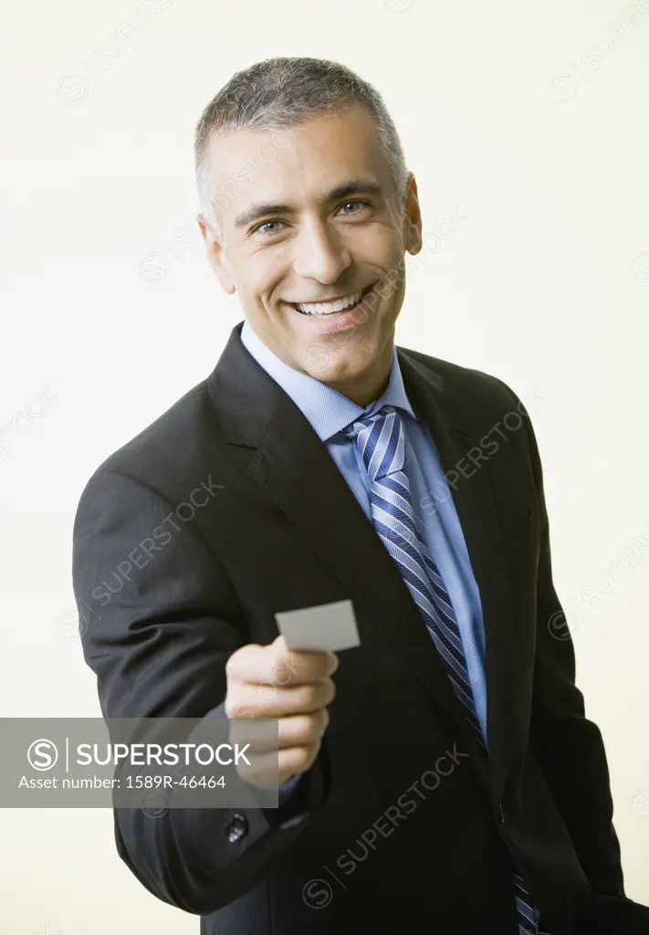 Middle Eastern businessman offering business card