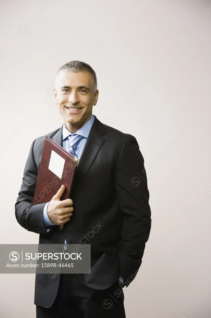 Middle Eastern businessman holding folder