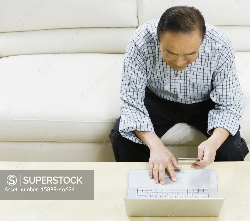 Senior Asian man shopping online