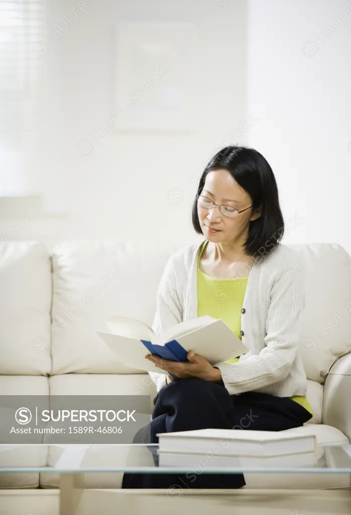 Asian woman reading book