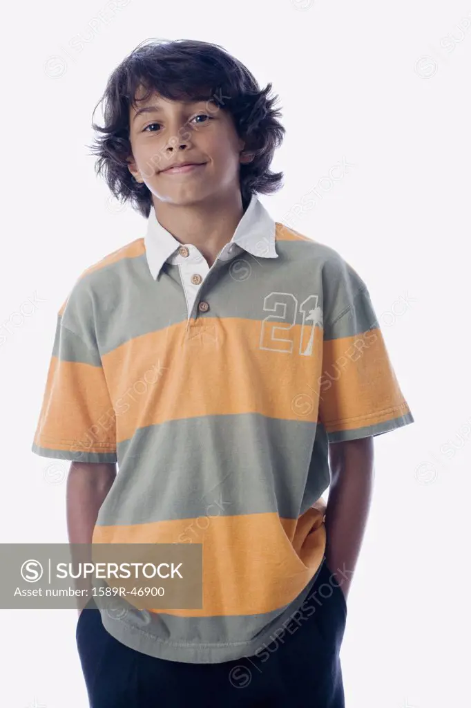 Hispanic boy with hands in pockets
