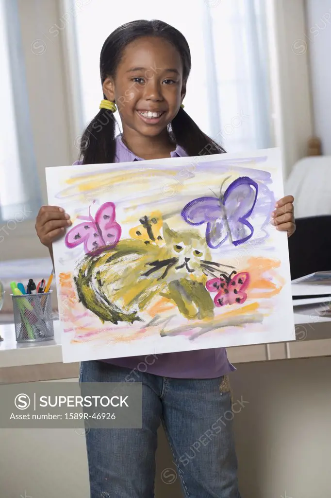 African American girl holding painting