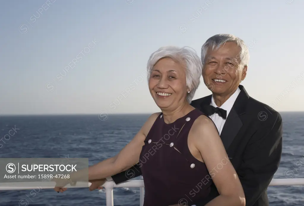 Senior Asian couple hugging