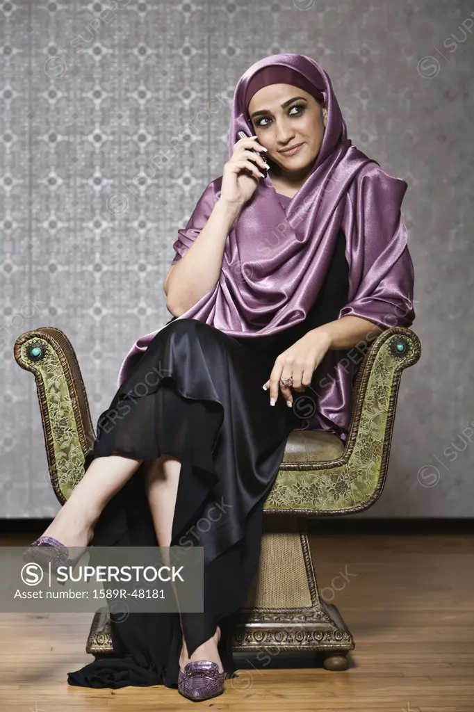 Middle Eastern woman talking on cell phone