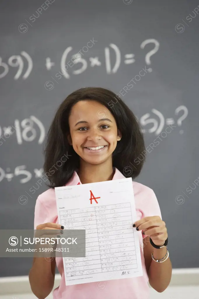 African American girl holding up A paper