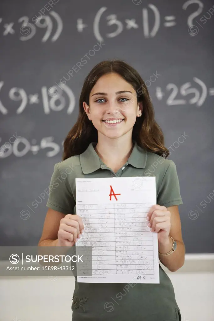Girl holding up A paper