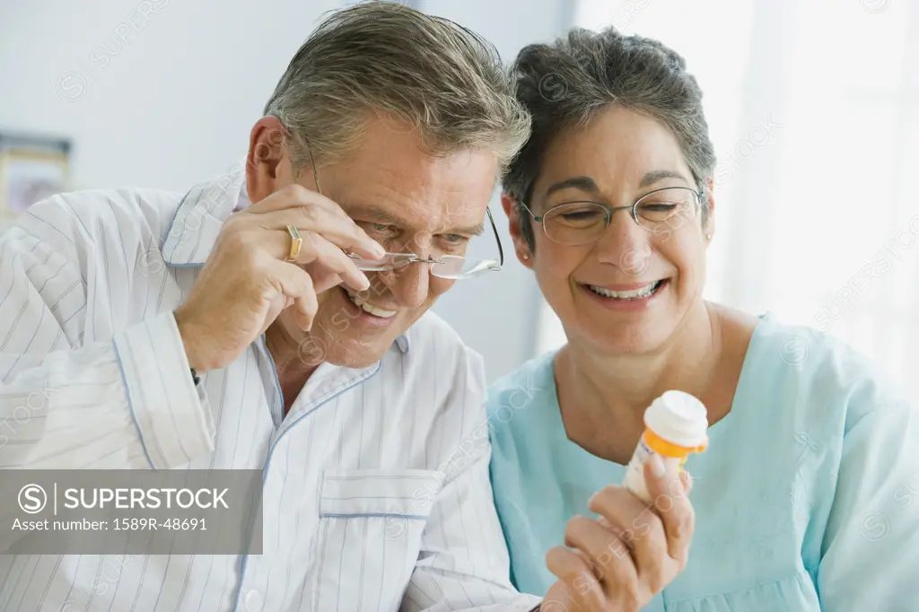 Senior couple looking at medication