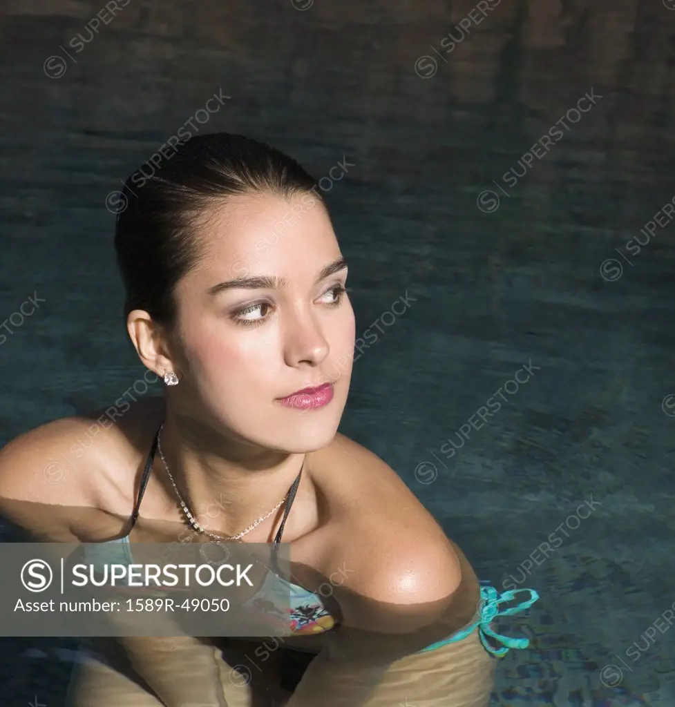 Hispanic woman in swimming pool