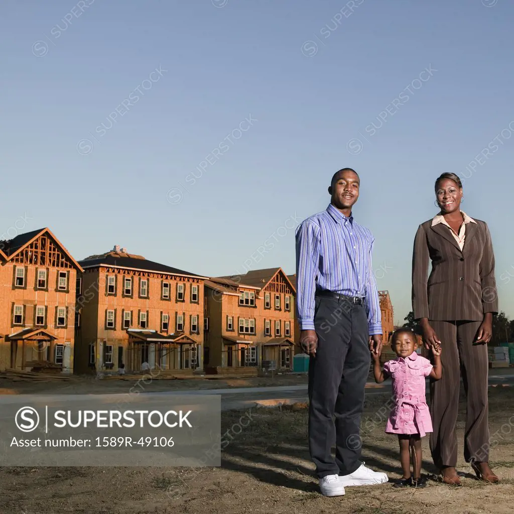 African American family at residential construction site