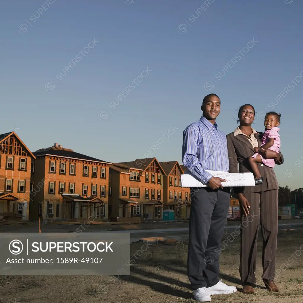 African American family at residential construction site