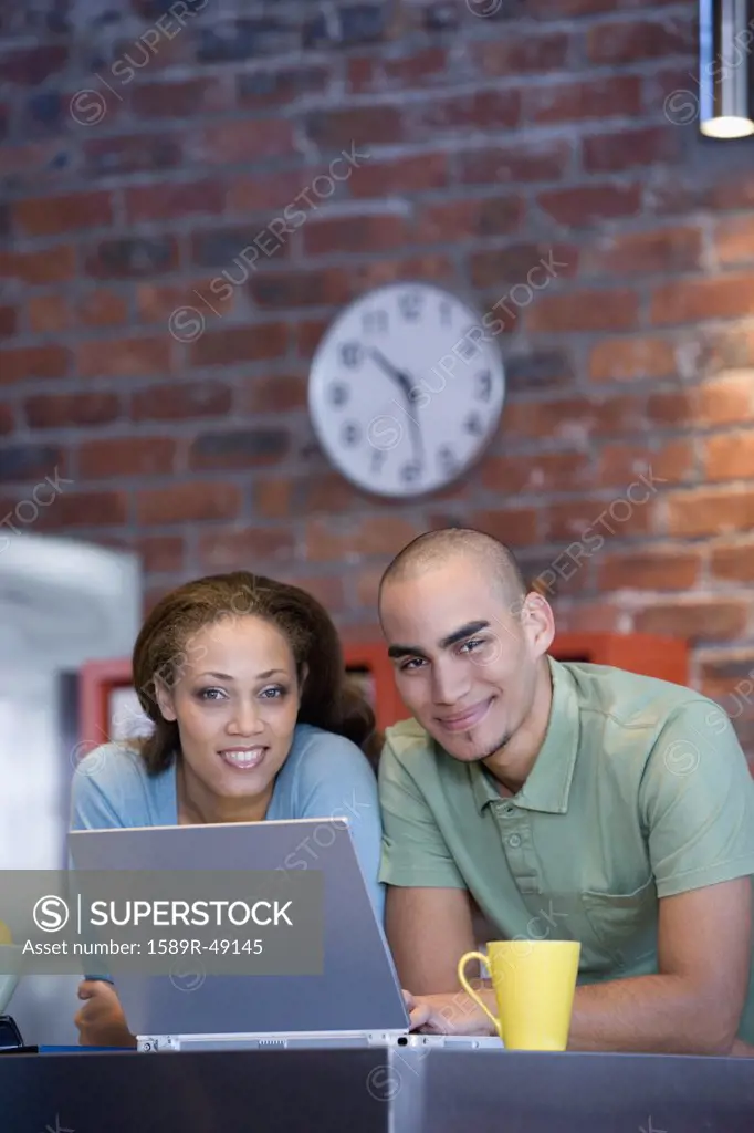 African American couple with laptop