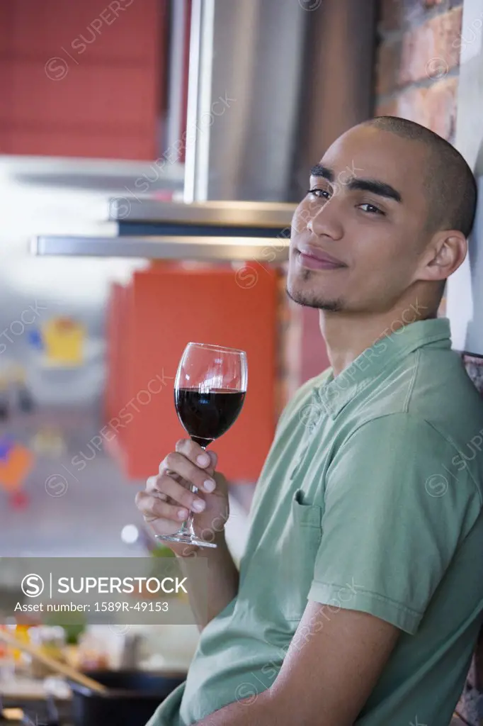 African American man drinking wine