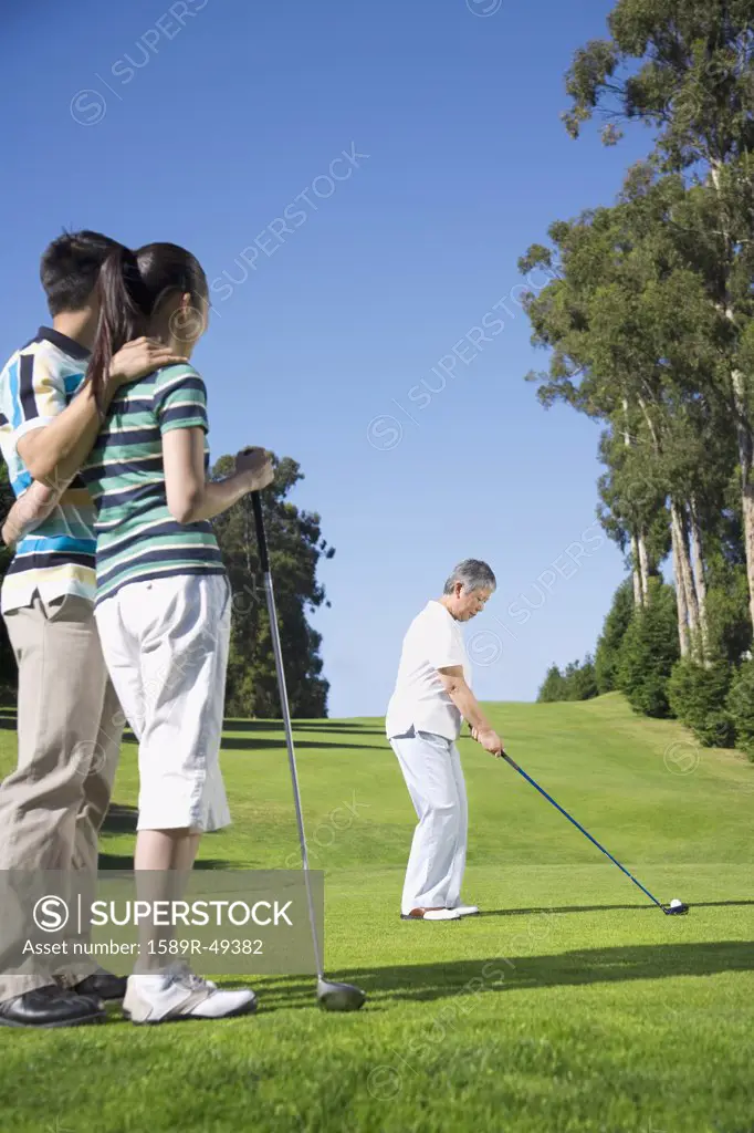 Senior Asian woman playing golf