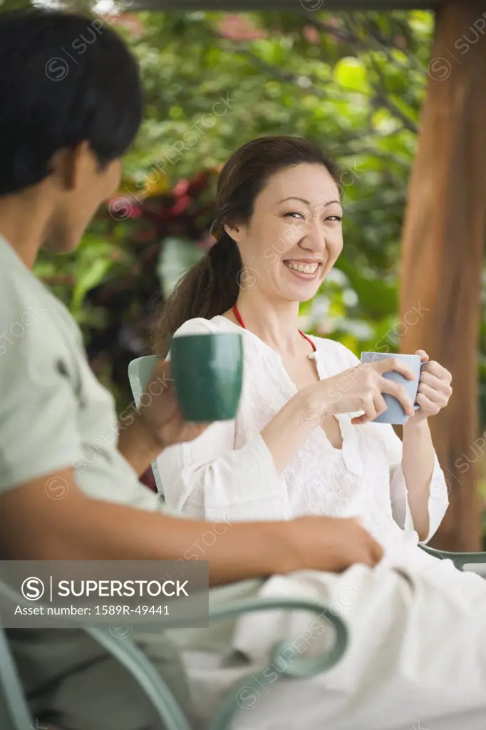 Asian couple drinking coffee
