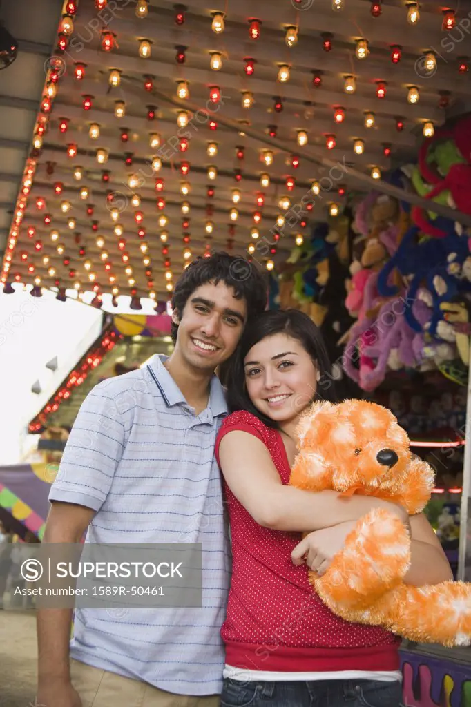 Multi-ethnic teenaged couple at carnival 