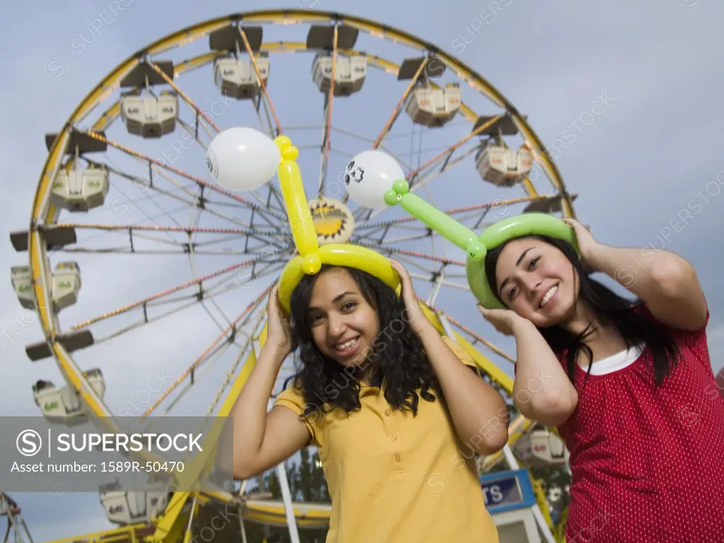 Multi-ethnic teenaged girls at carnival