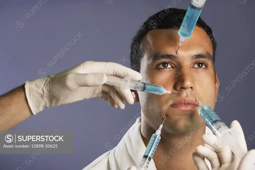 Hispanic man receiving injections in face