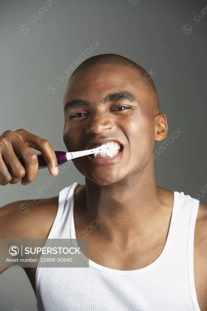 African man brushing teeth