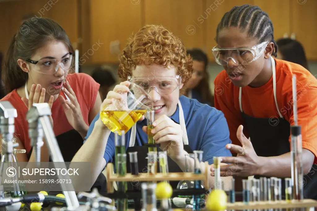 Multi-ethnic teenaged students in science class