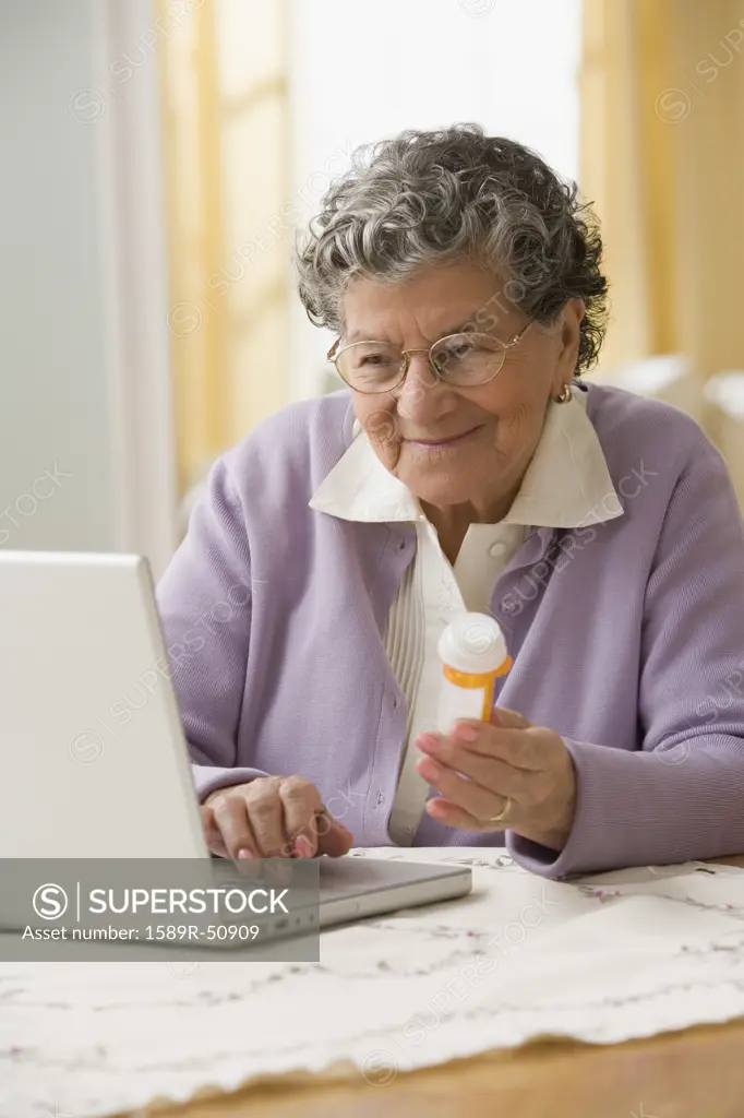 Senior Hispanic woman looking up medication online