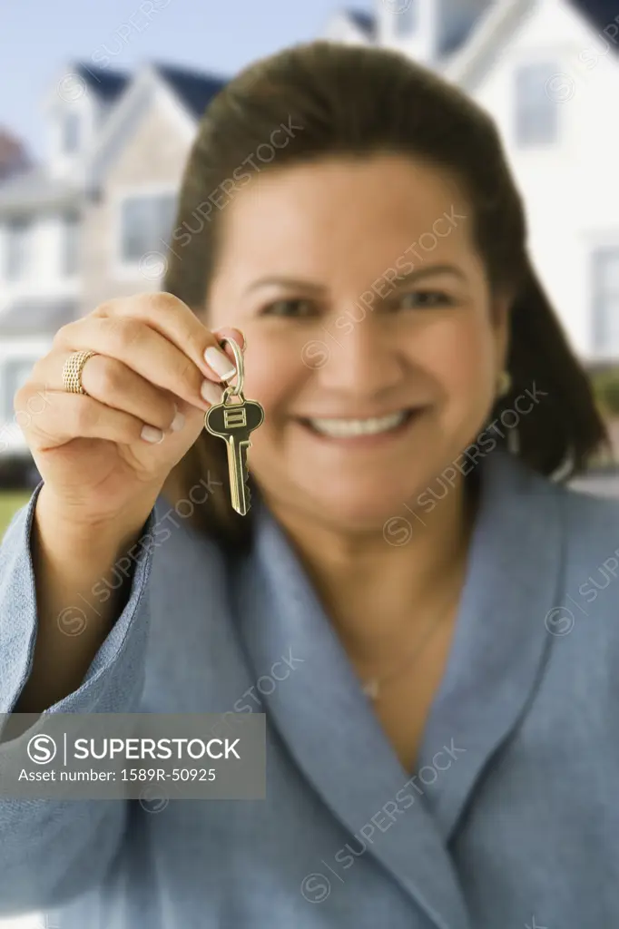 Hispanic woman holding house key