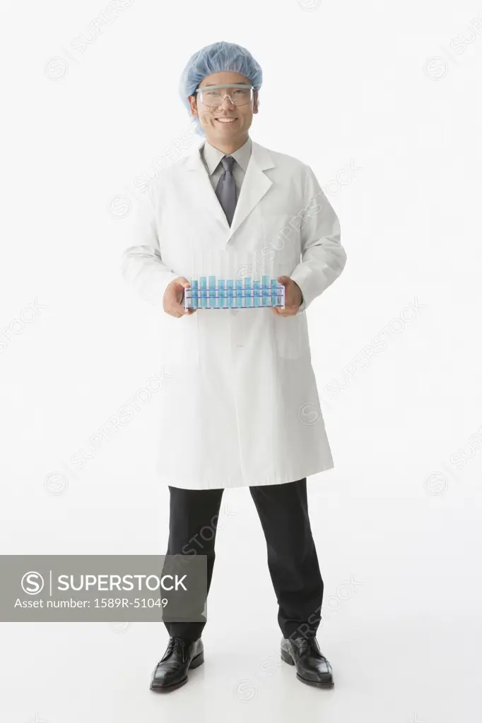 Asian male scientist holding tray of vials