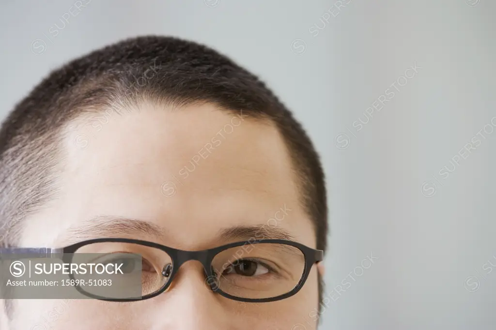 Close up of Asian man wearing eyeglasses