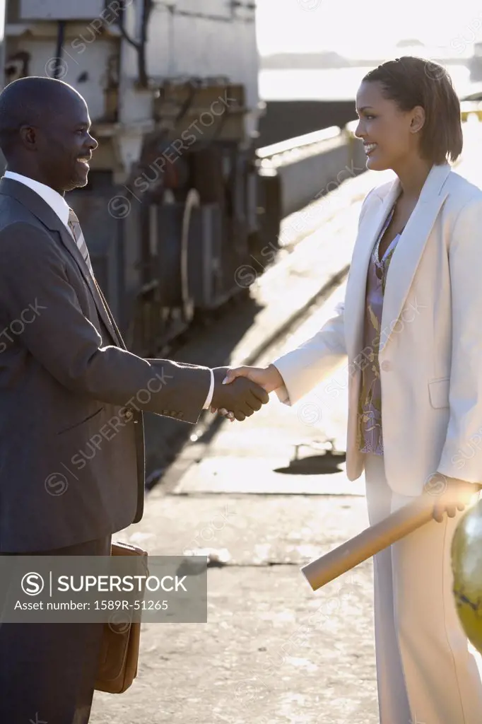 African American businesspeople shaking hands