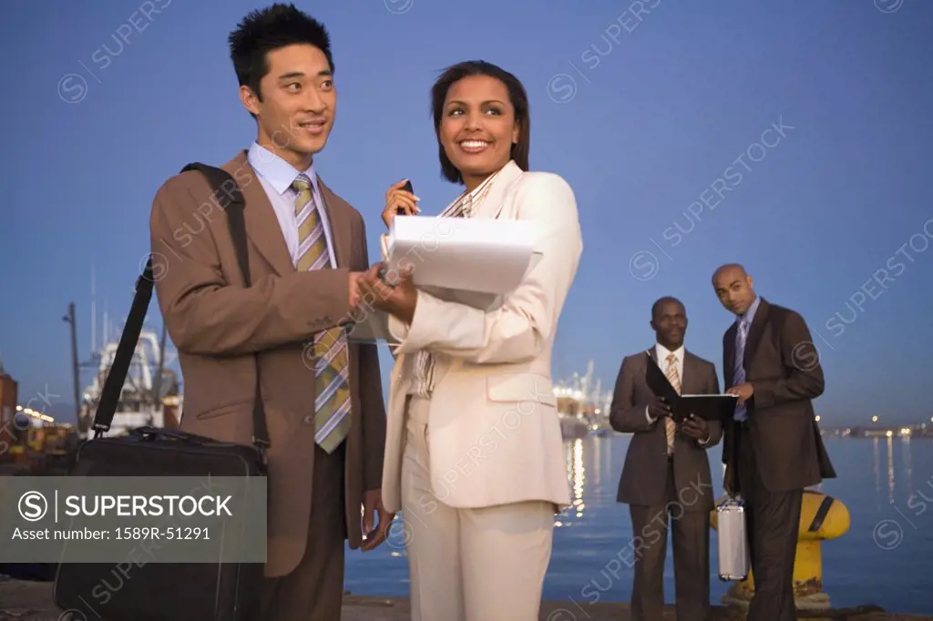 Multi-ethnic businesspeople on commercial pier
