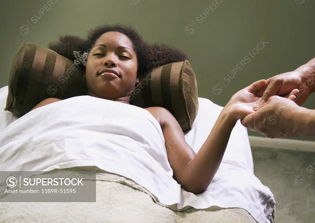 African woman receiving massage
