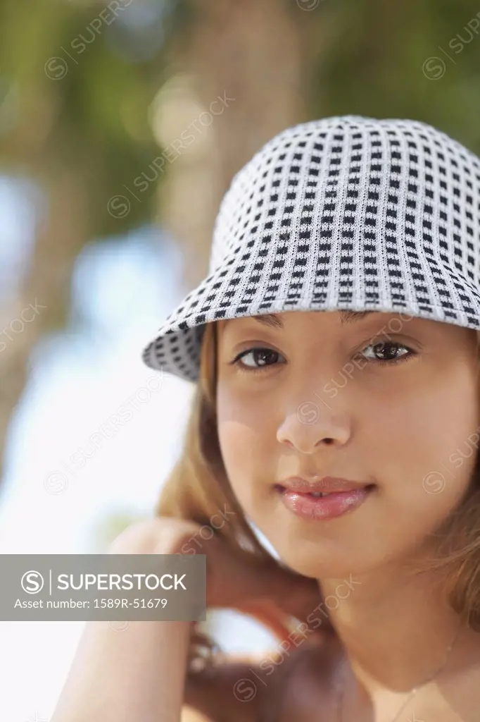 Hispanic woman wearing hat