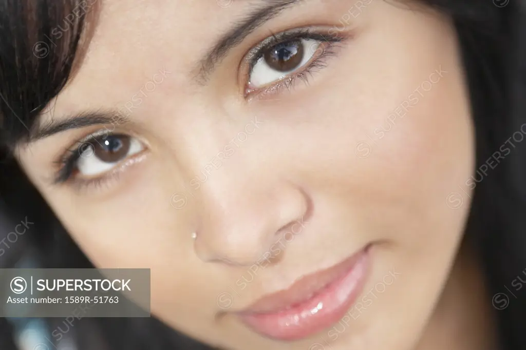 Close up of Hispanic woman with nose ring