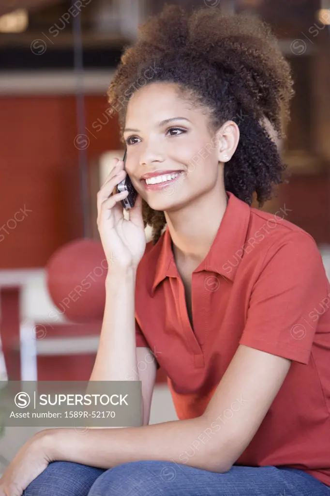 African woman talking on cell phone