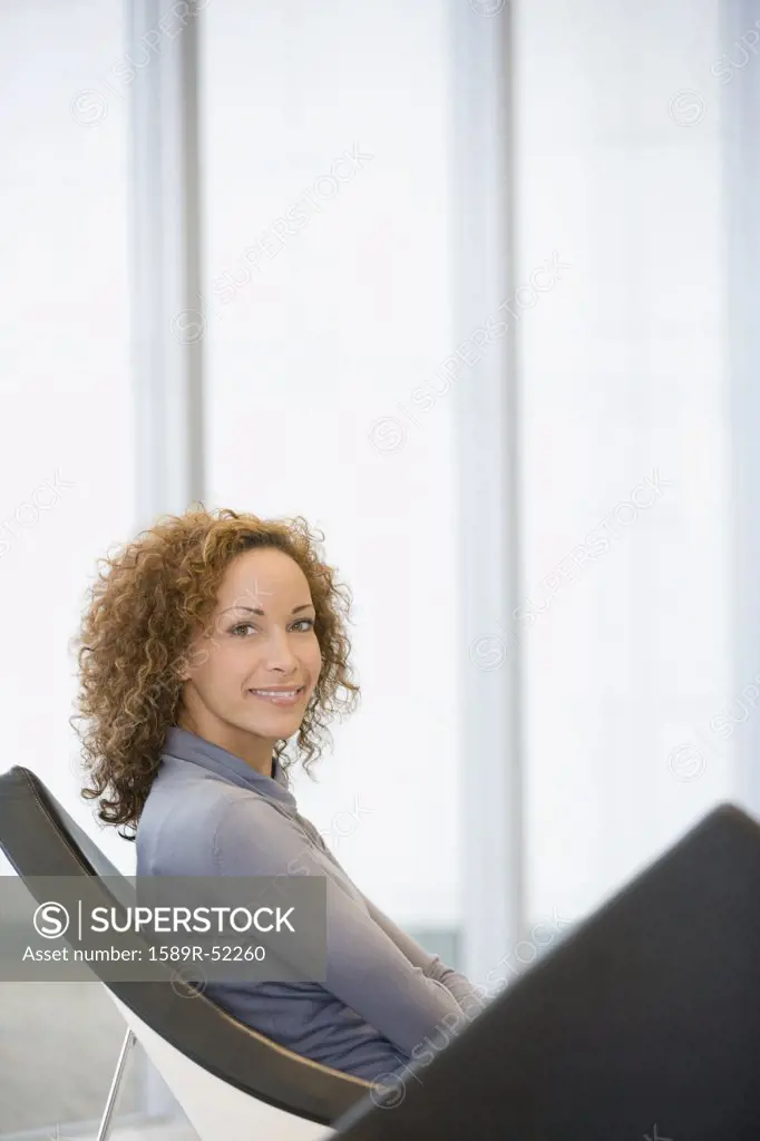 African woman sitting in chair