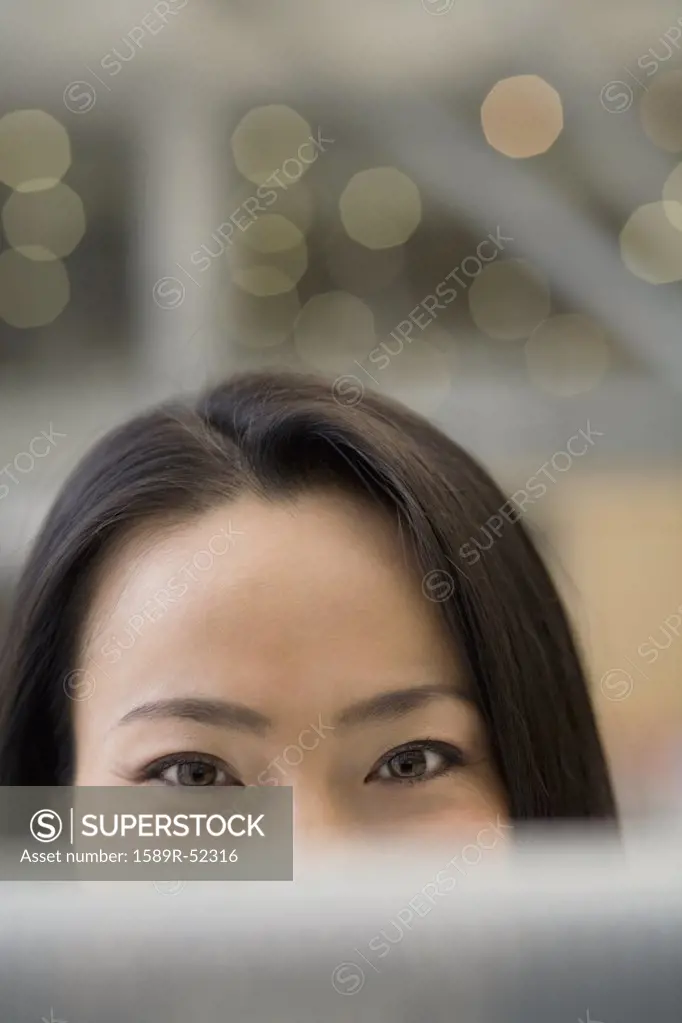 Top half of Asian womans face