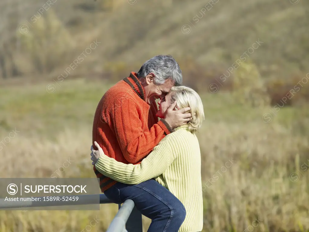Multi-ethnic couple hugging