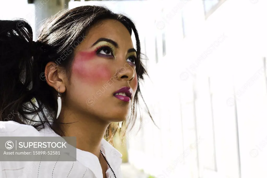 Young Asian woman wearing dramatic makeup