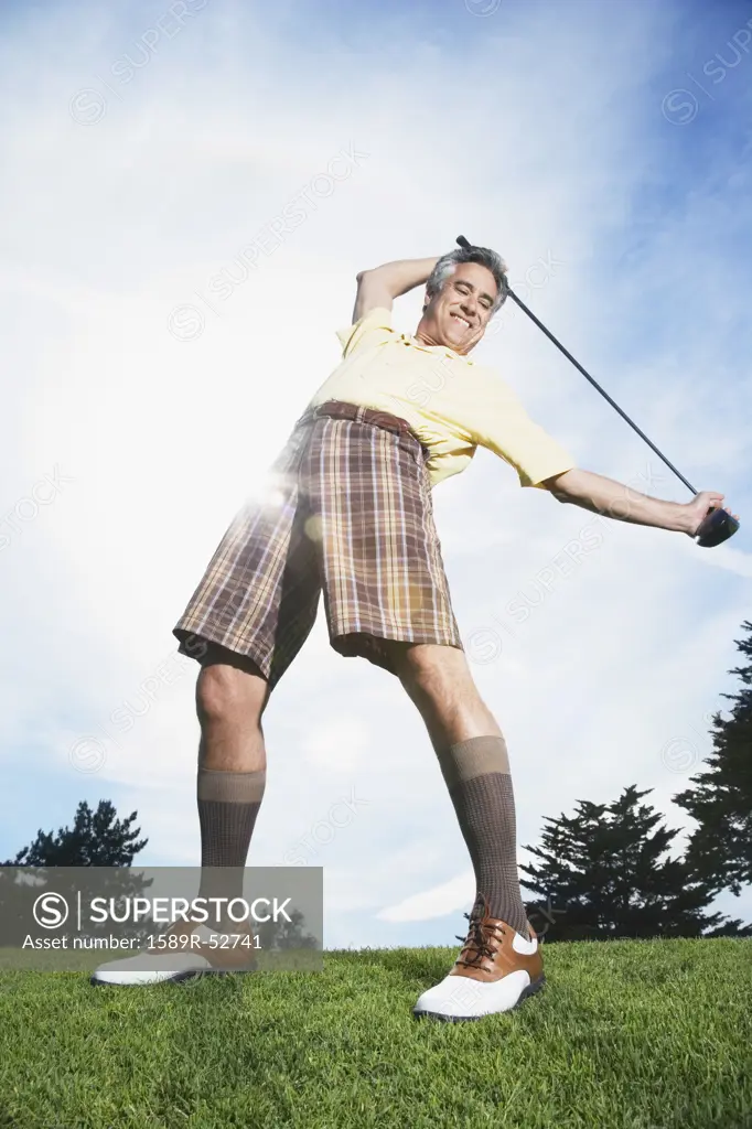 Man holding golf club