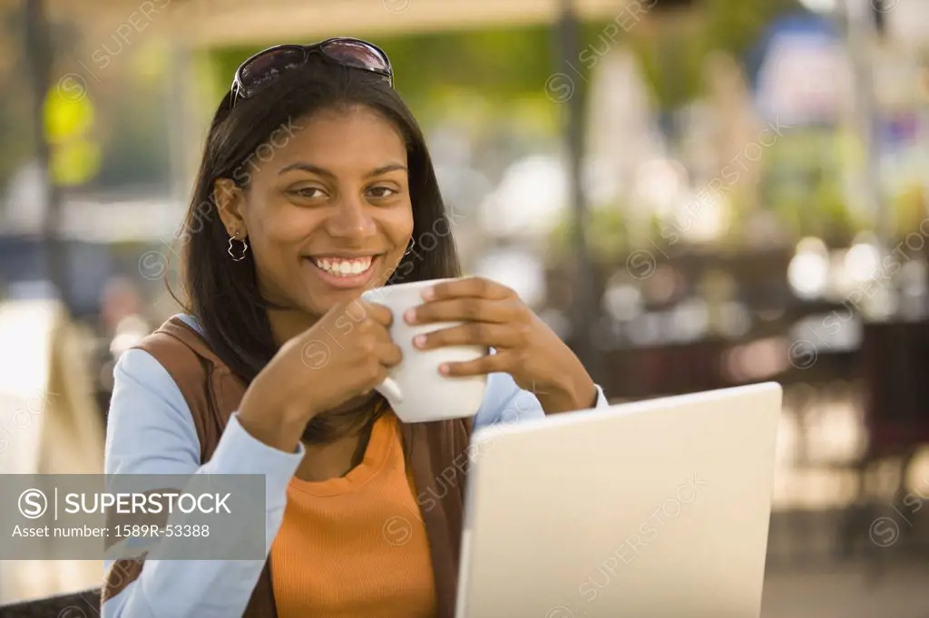 African woman drinking coffee