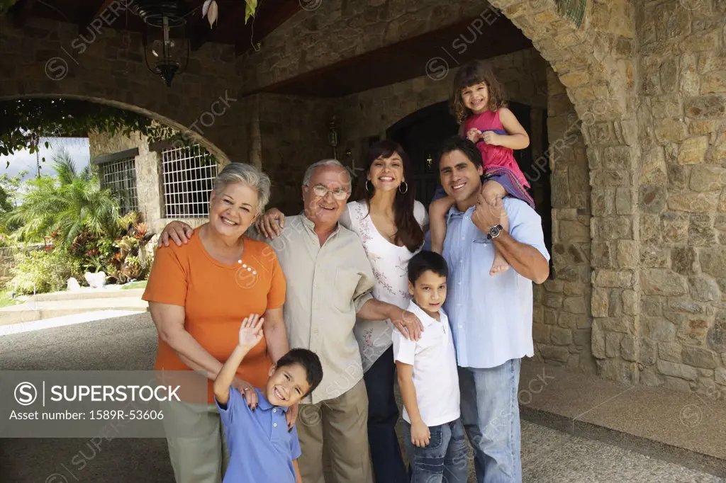 Multi-generational Hispanic family under overpass