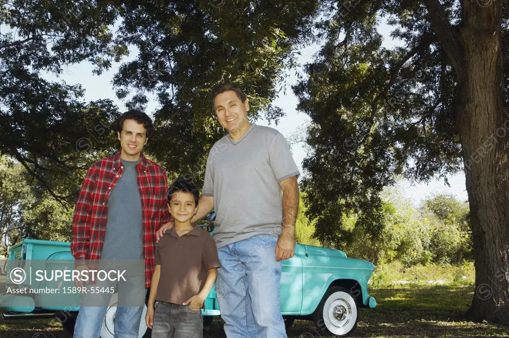 Multi-ethnic family in front of truck