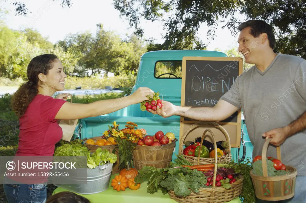 Hispanic couple at organic farm stand